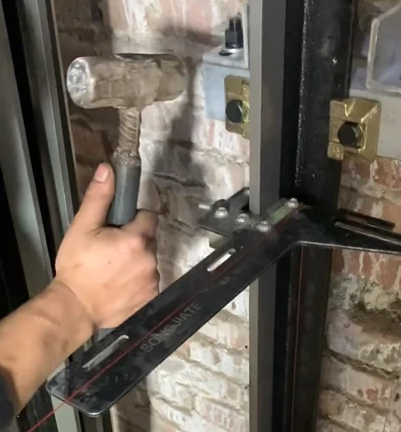 Checking elevator guide rail bracket alignment