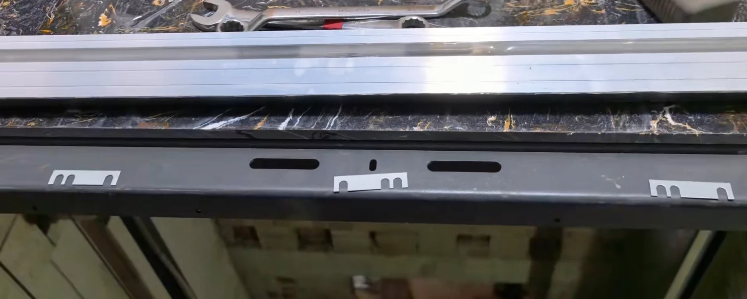 technician checking elevator car platform level