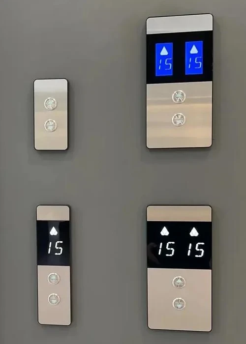 Passenger using an elevator call button